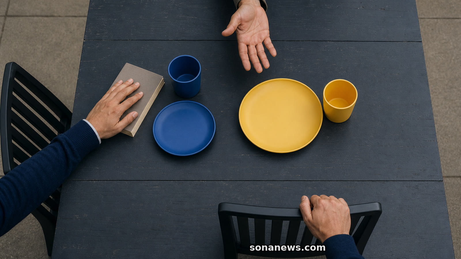Hands gather around yellow tableware while blue tableware marks a separate quiet seat, illustrating small-talk signals.